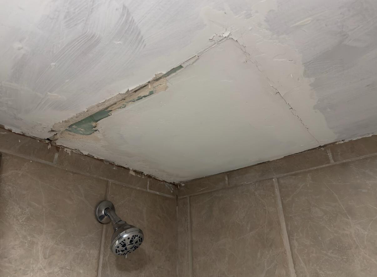Bad ceiling repair above shower