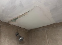 Bad ceiling repair above shower