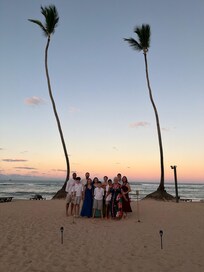 Family photo on the beach at golden hour