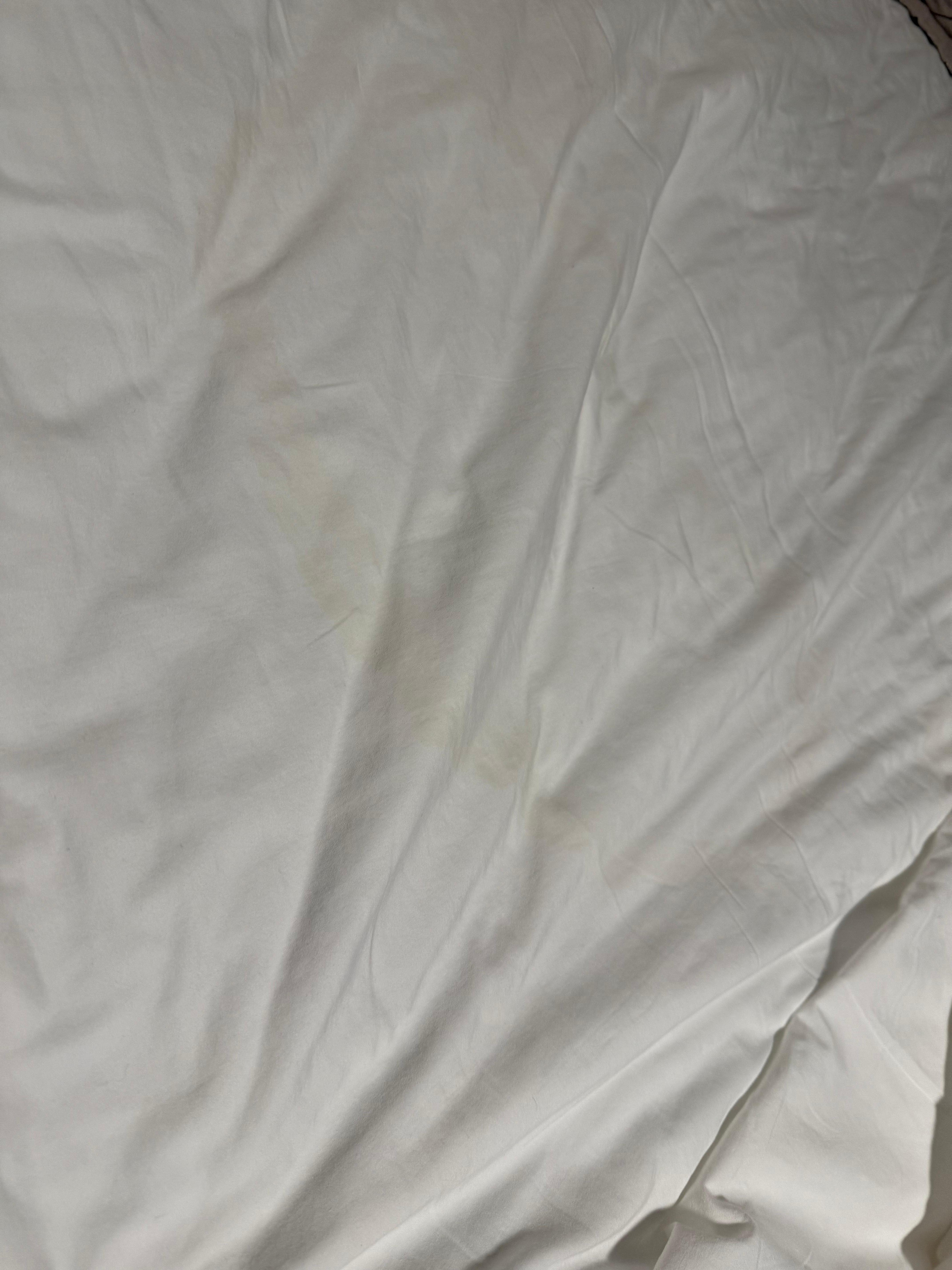 Big yellow stain on sheet,