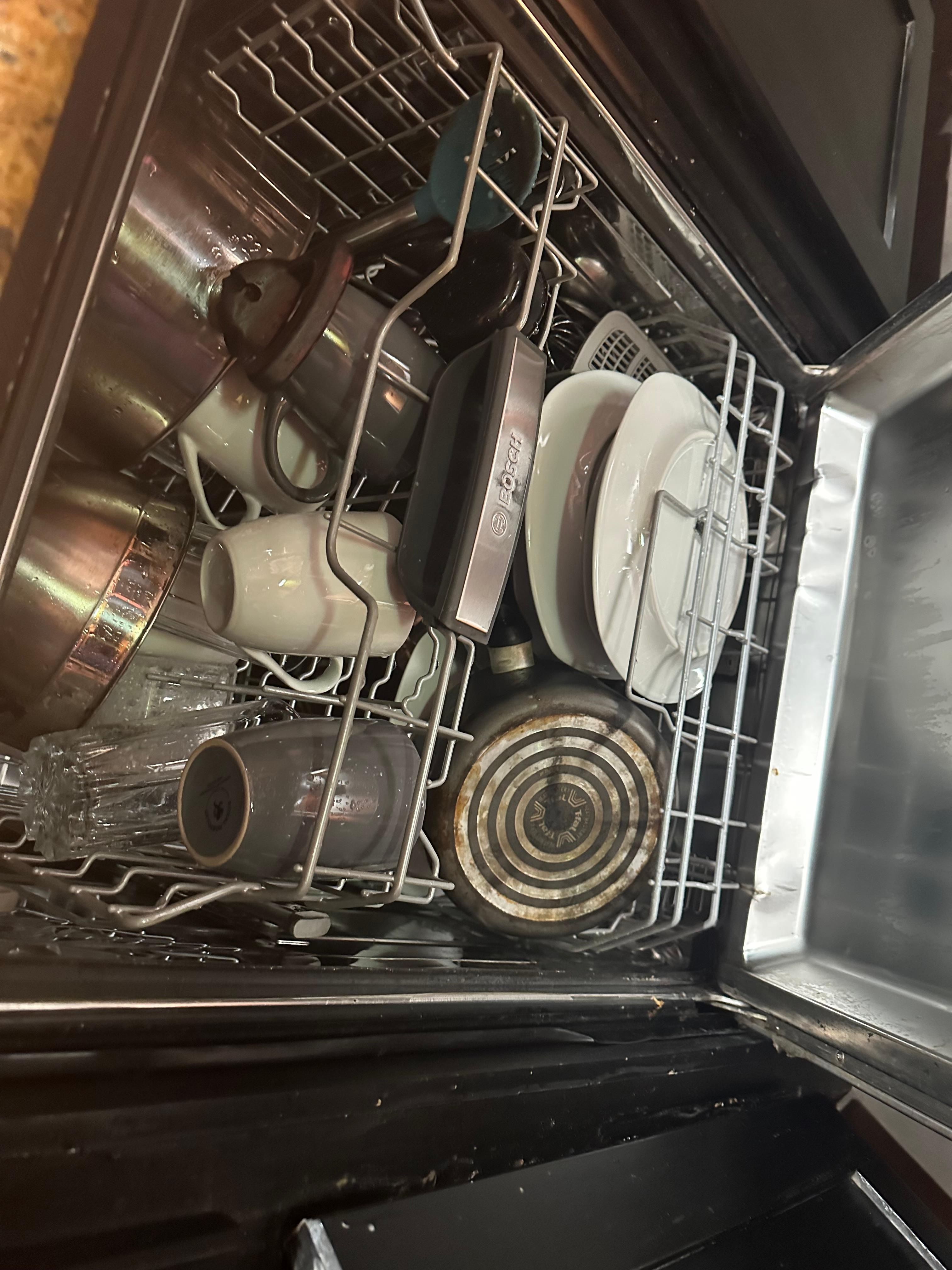 Dirty smelly dishes in the dishwater upon arrival