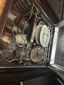 Dirty smelly dishes in the dishwater upon arrival