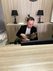 Receptionist with calm cat
