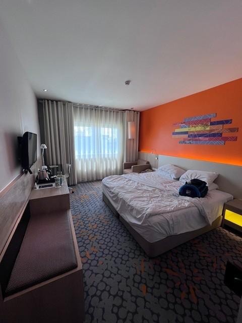 Mind my personal mess. But room was big and spacious, with a view. Sheets were clean and bed was comfortable. Wardrobe was spacious with hangers provided and a Safe lock box too. Plenty of power sockets to charge your devices.