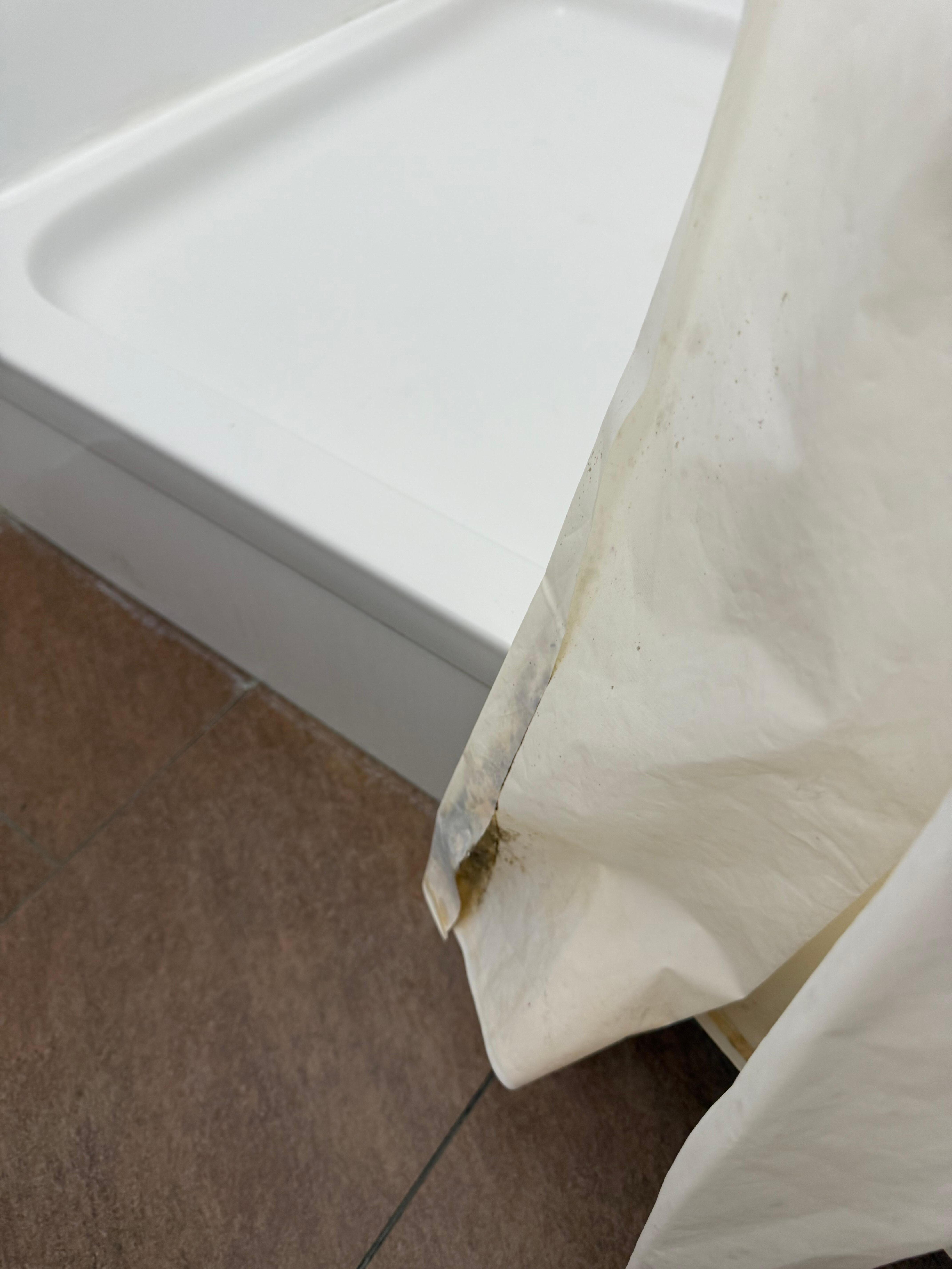 Someone else’s dirt in the shower pan