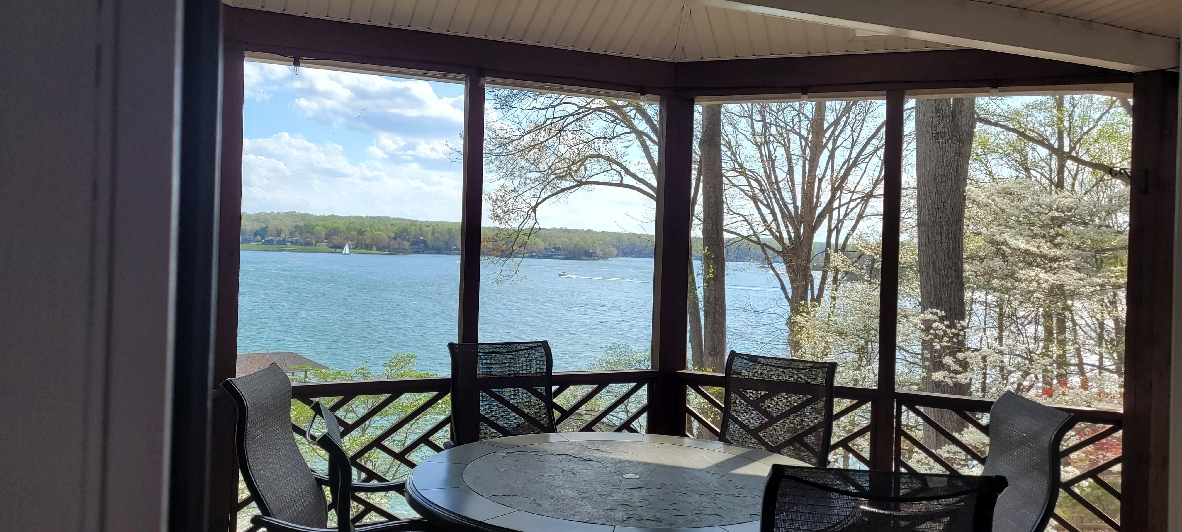 screened in porch with seating - their is also a green egg grill off to the left