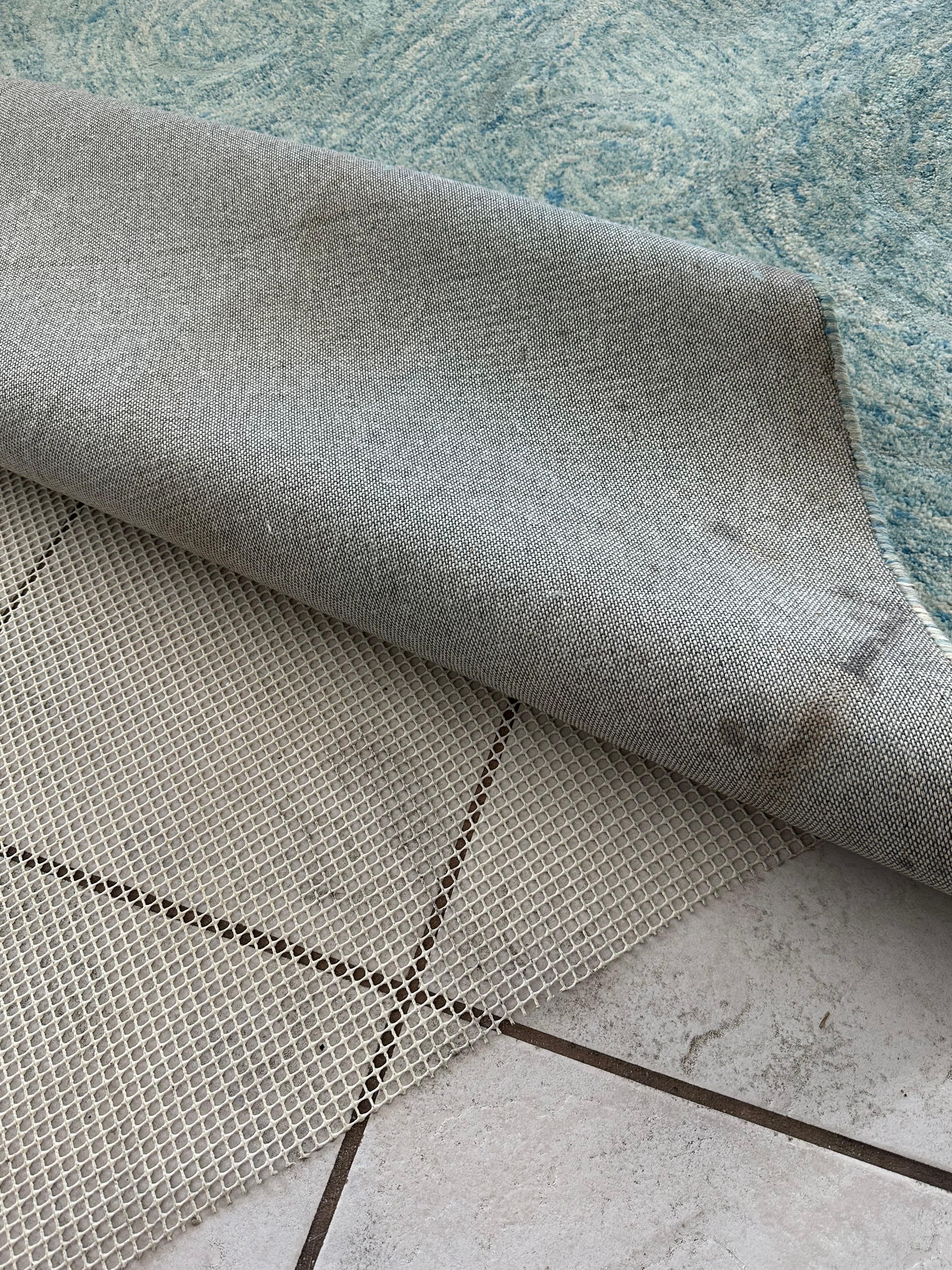 The backside of the area rug in the living room. 