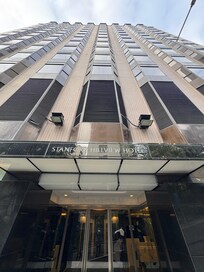 Front of hotel, also an elevator option from garage level to avoid half the steep climb.