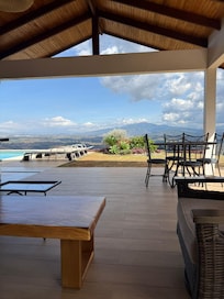 Covered area with a beautiful view wonderful for morning coffee, reading and evening cocktails.