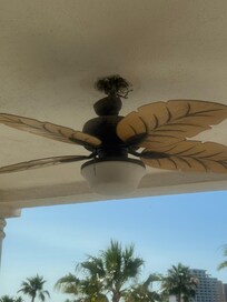 Broken ceiling fan detached from ceiling