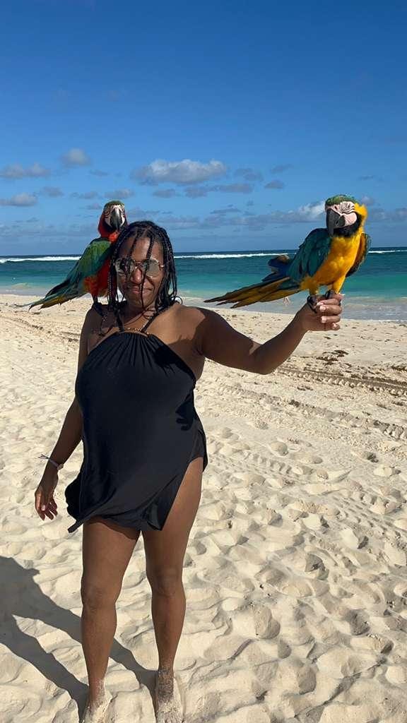 Never thought I'd be holding parrots on the beach but here I am ☺️