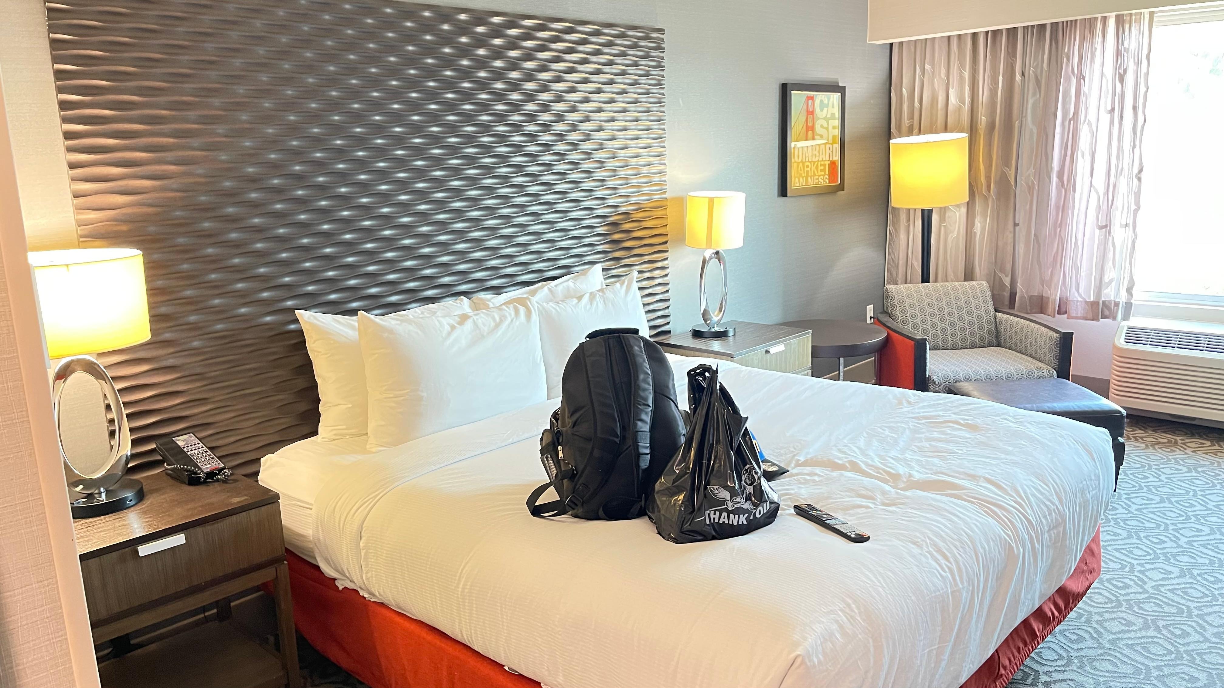 The bed and view of the living space. 