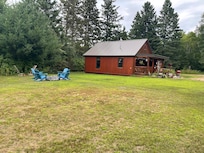 Outside of cabin and fire pit