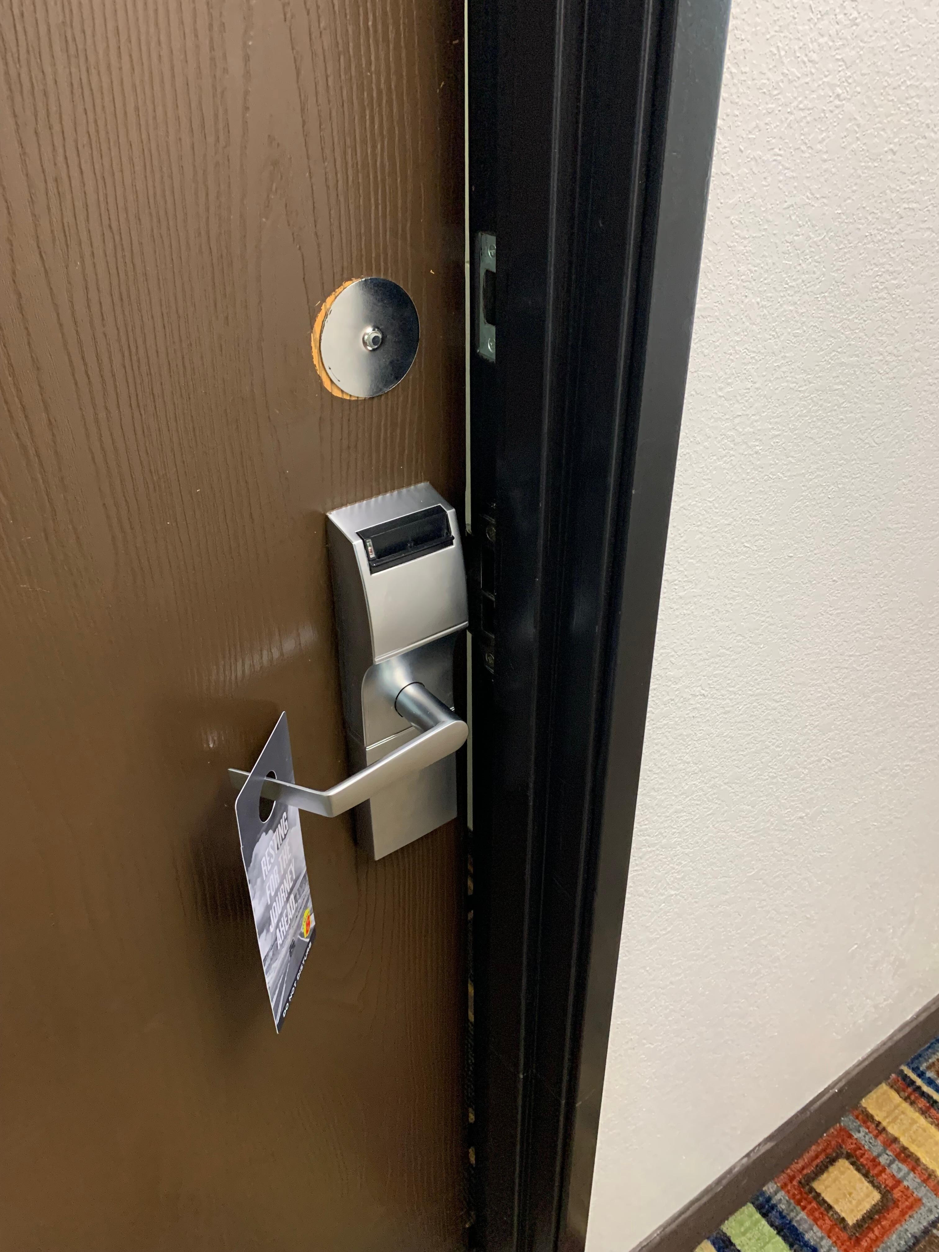 Room door blocked and left open by staff all day.