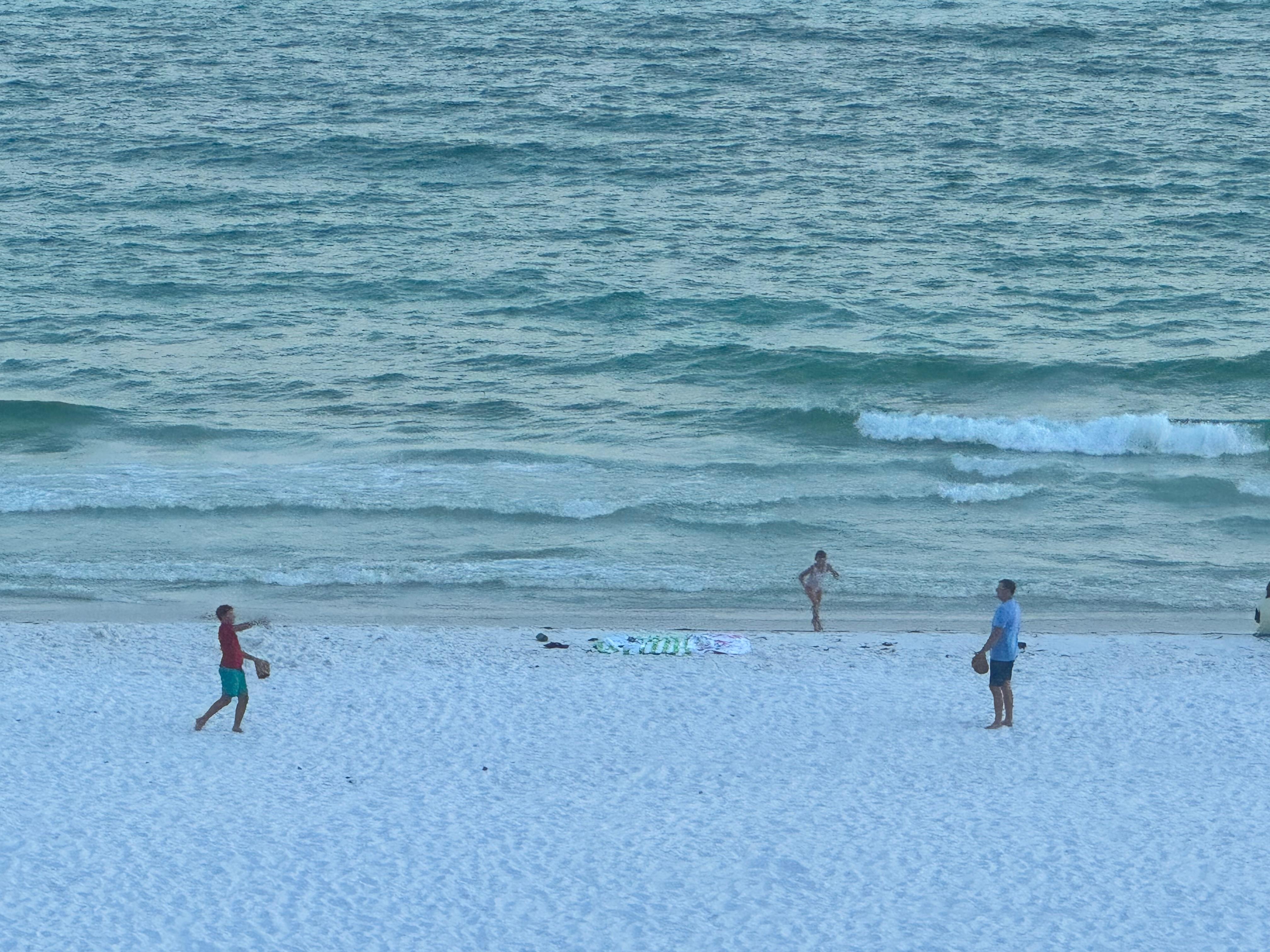 Playing catch on the beach.