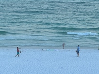 Playing catch on the beach.