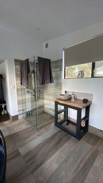 Shower and bathroom sink. The tank water is non-potable but some bottled water is provided.