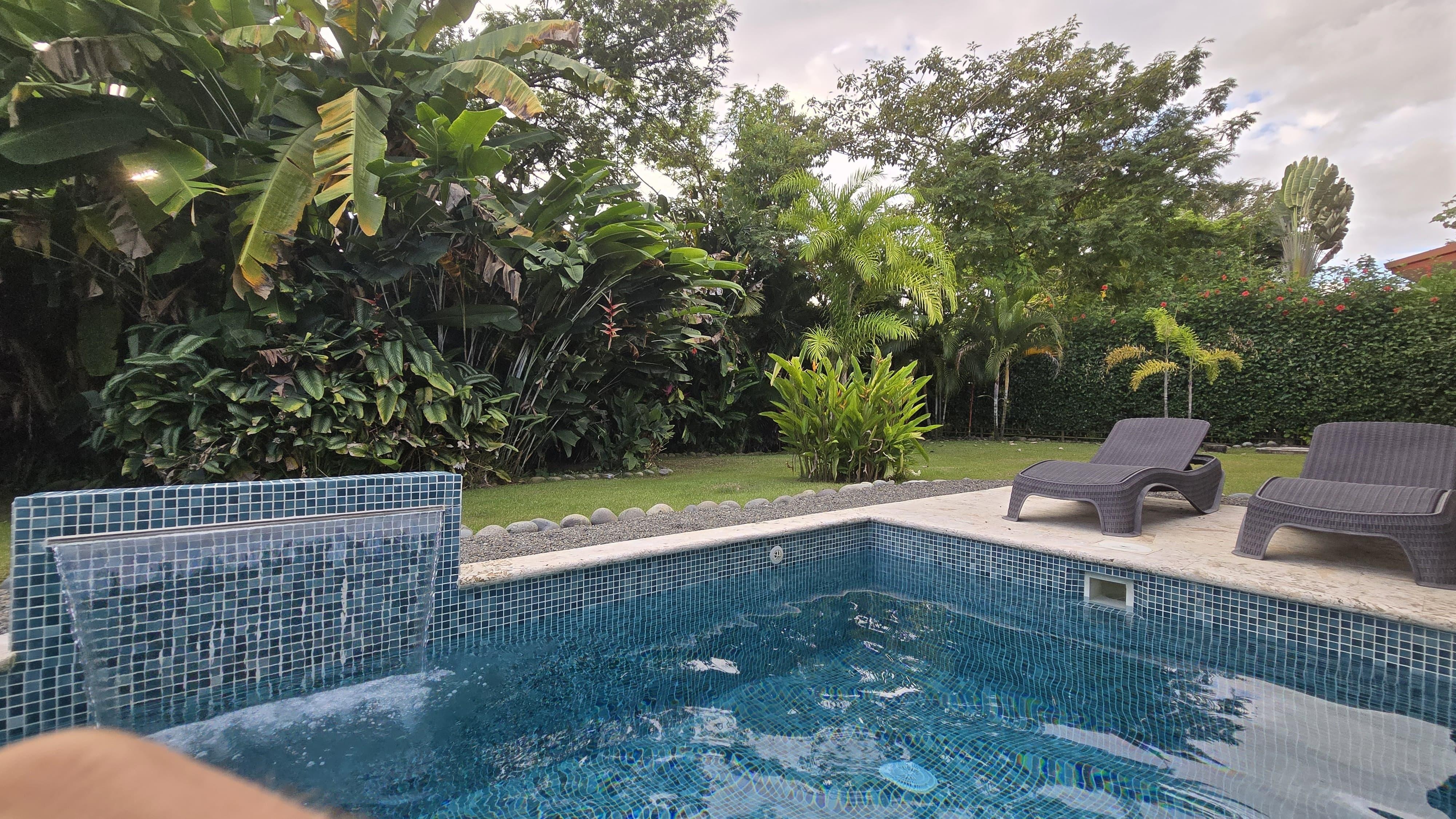 Backyard with nice pool and waterfall.