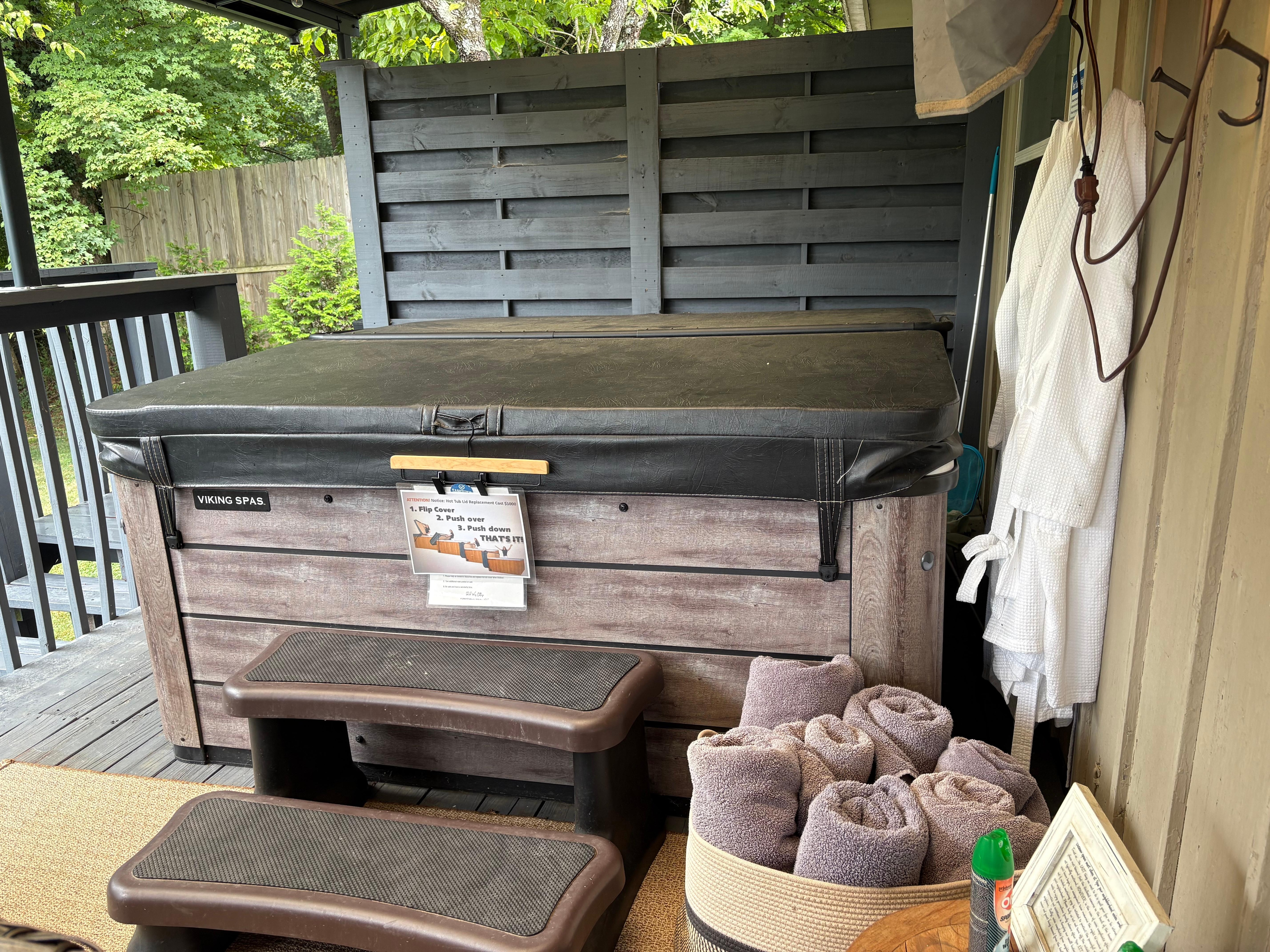 Nice private hot tub with towels and robes. 