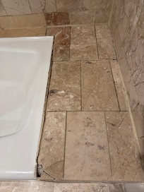 Cracked tiles (looks bad and potentially dangerous if I had kids)