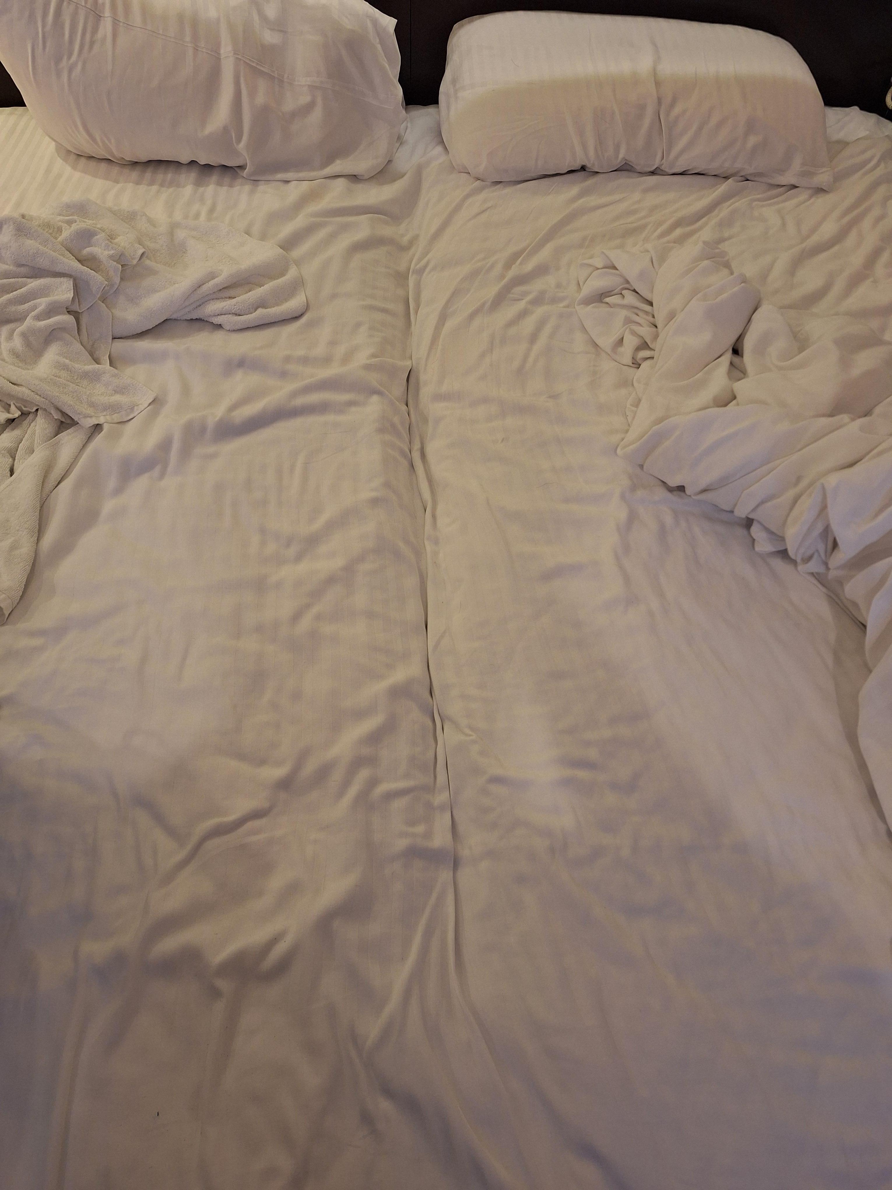 The trace of making a double bed by putting two single beds together 