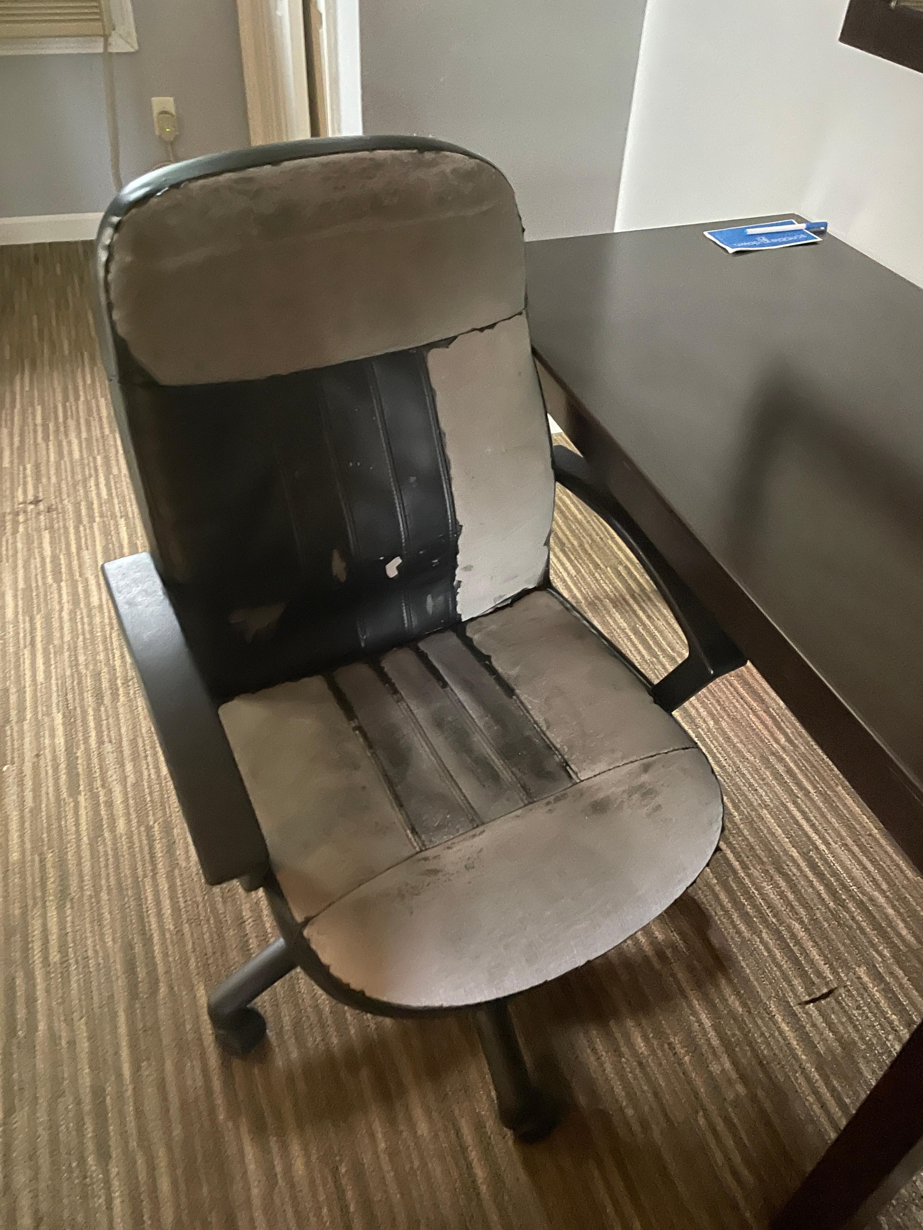 Desk chair belongs at the dump