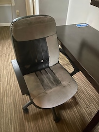Desk chair belongs at the dump