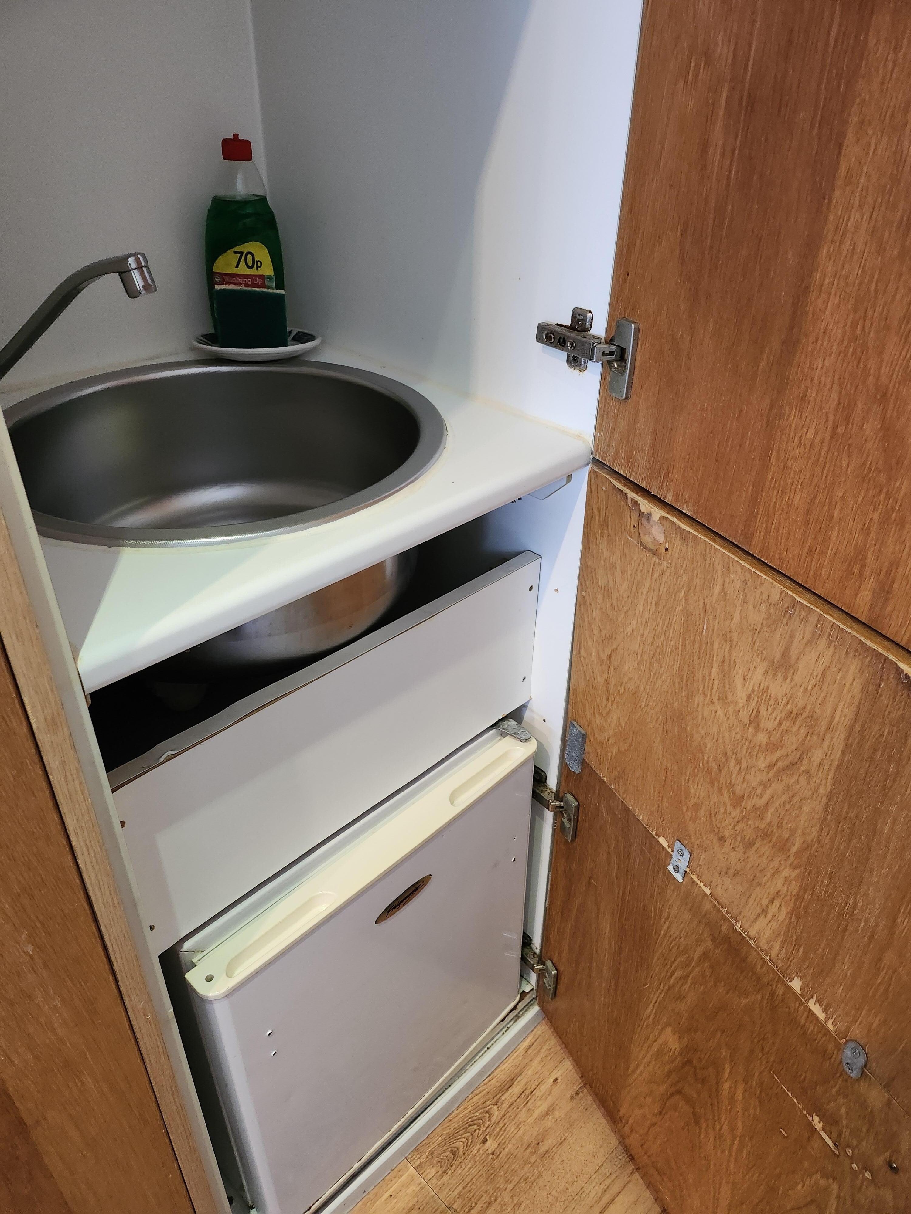 Kitchen sink and mini-fridge