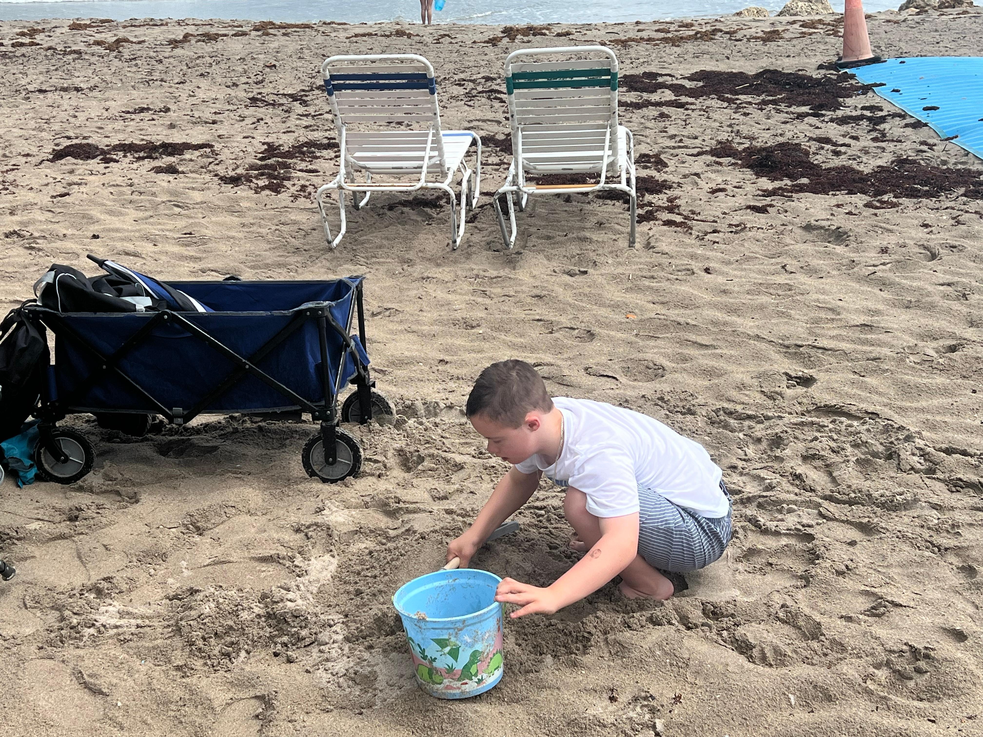 Our son playing in the sand