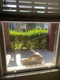 This horrific property was complete with a cracked window as well!