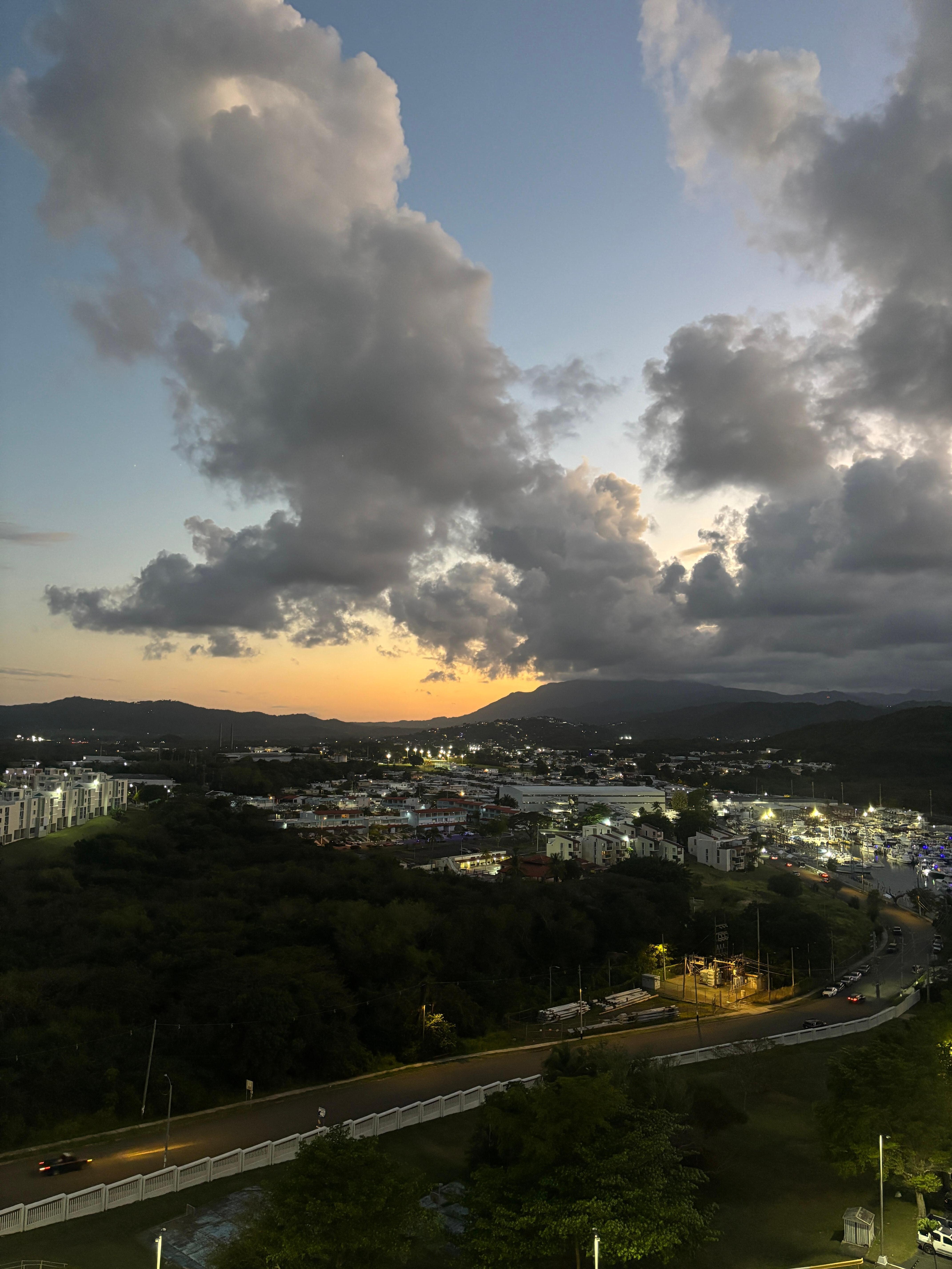 View at dusk over front balcony. 