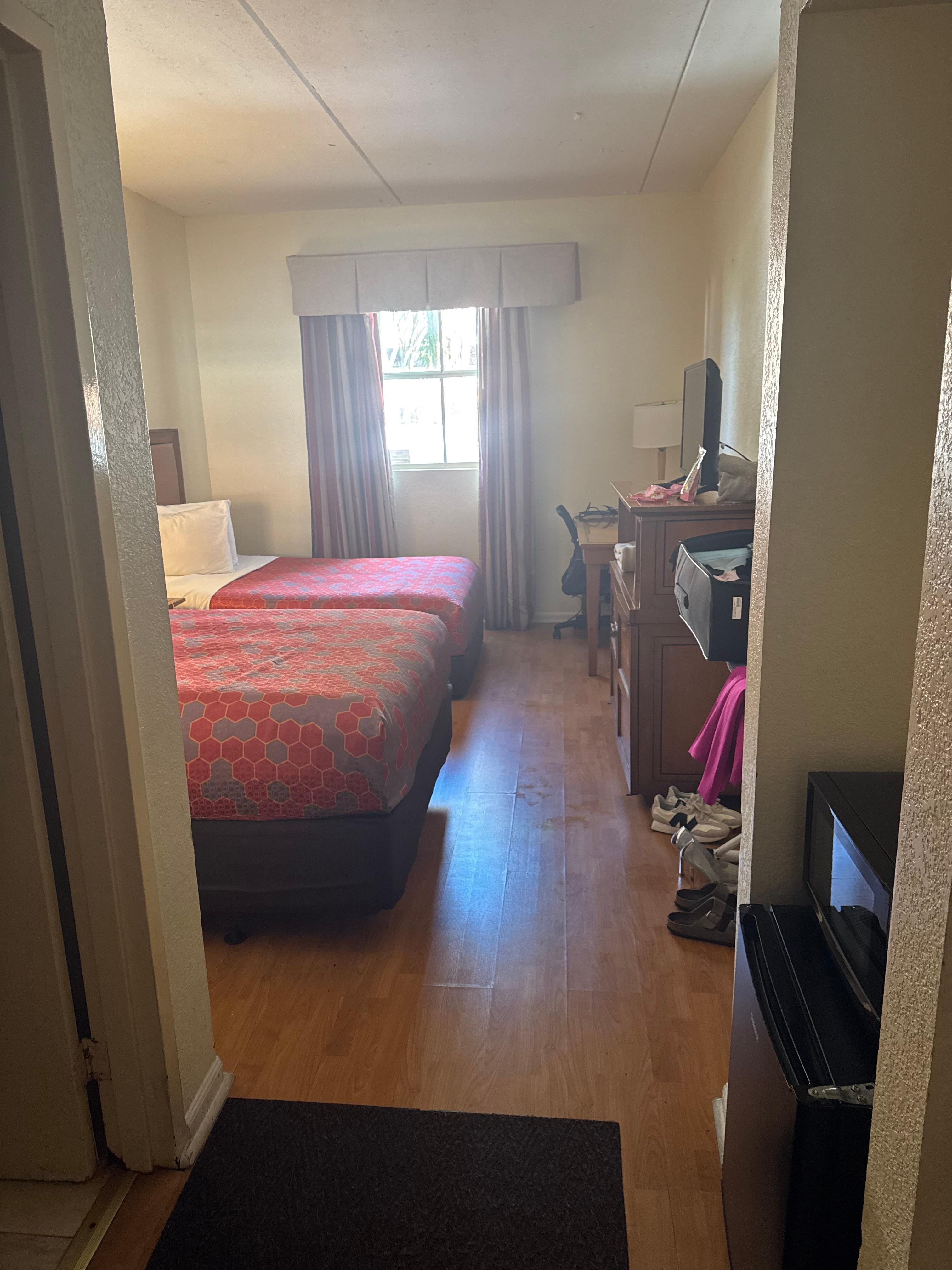 The only reason there would be cheap laminate flooring in a room is bc someone died in there. No other rooms I saw had these floors.