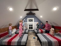 The children loved the bedroom on the top floor where they all could sleep together.