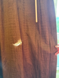 Hole in curtain