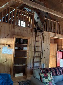 Ladder to loft. Pulls out and may stay in place.