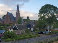 The cottage sits adjacent to the main house.
