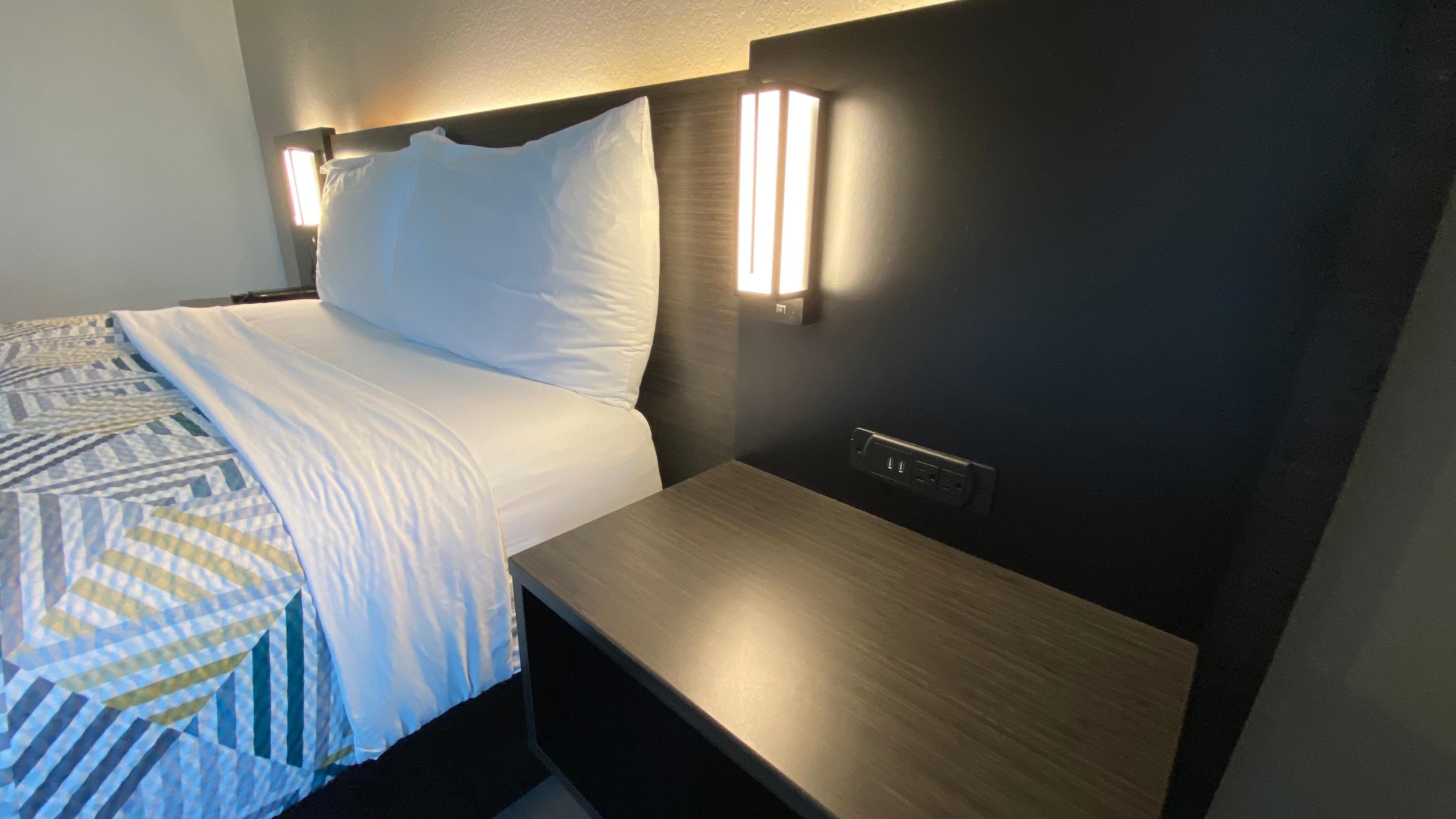 Nice little outlets station on both side of the bed, LED warm lighting on the back of the board on the bed (switch is option for on/off). 