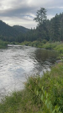 River by the bridge, about a 5-10 minute walk