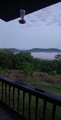 Morning fog lifting from the river below the cabin