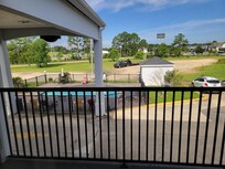 View from 2nd floor. Note the dirt and unkept landscape in the distance