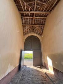 The entrance from the outside into the courtyard area.