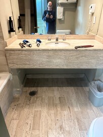 Plumber at work…unfortunately toilet not fixed to function properly.