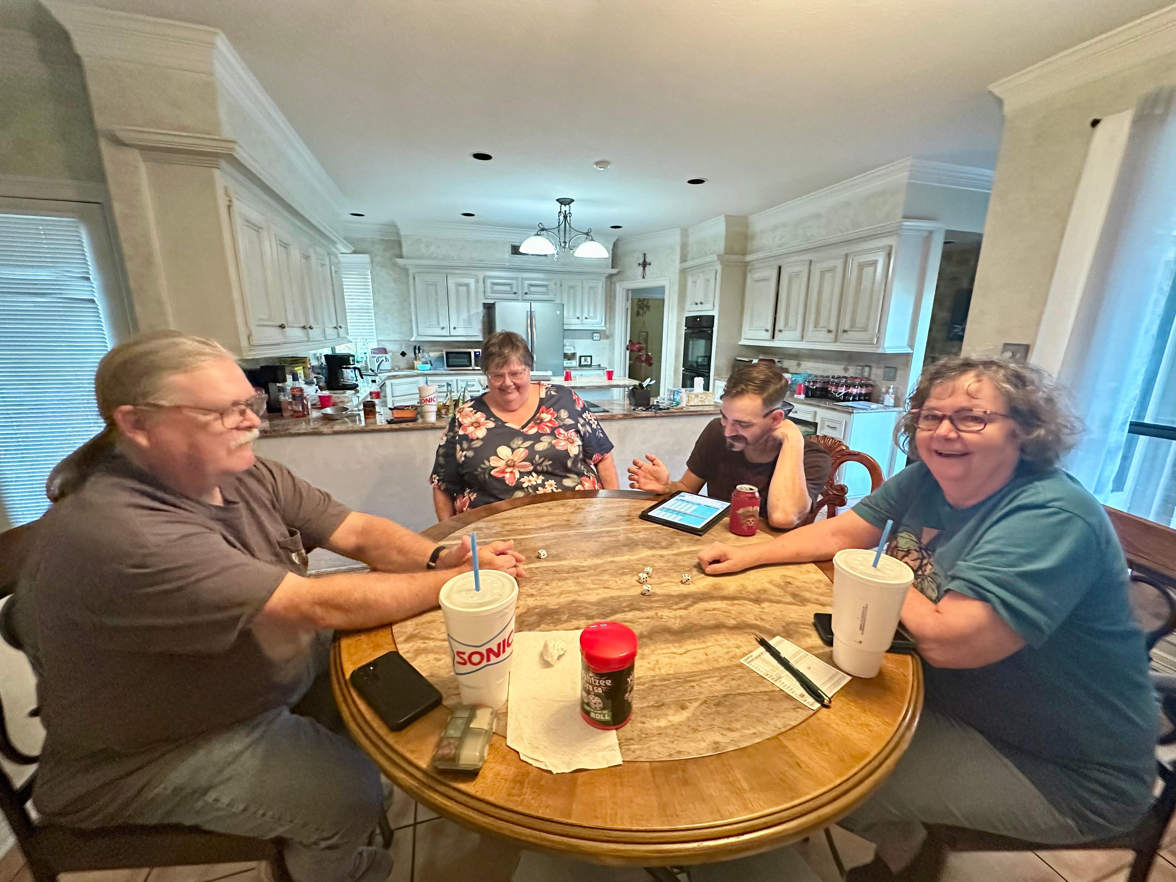 Yahtzee at the small table by the kitchen