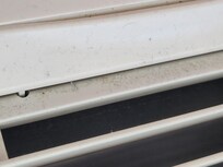 Outside of a/c unit. A little hard to see dust & grime.