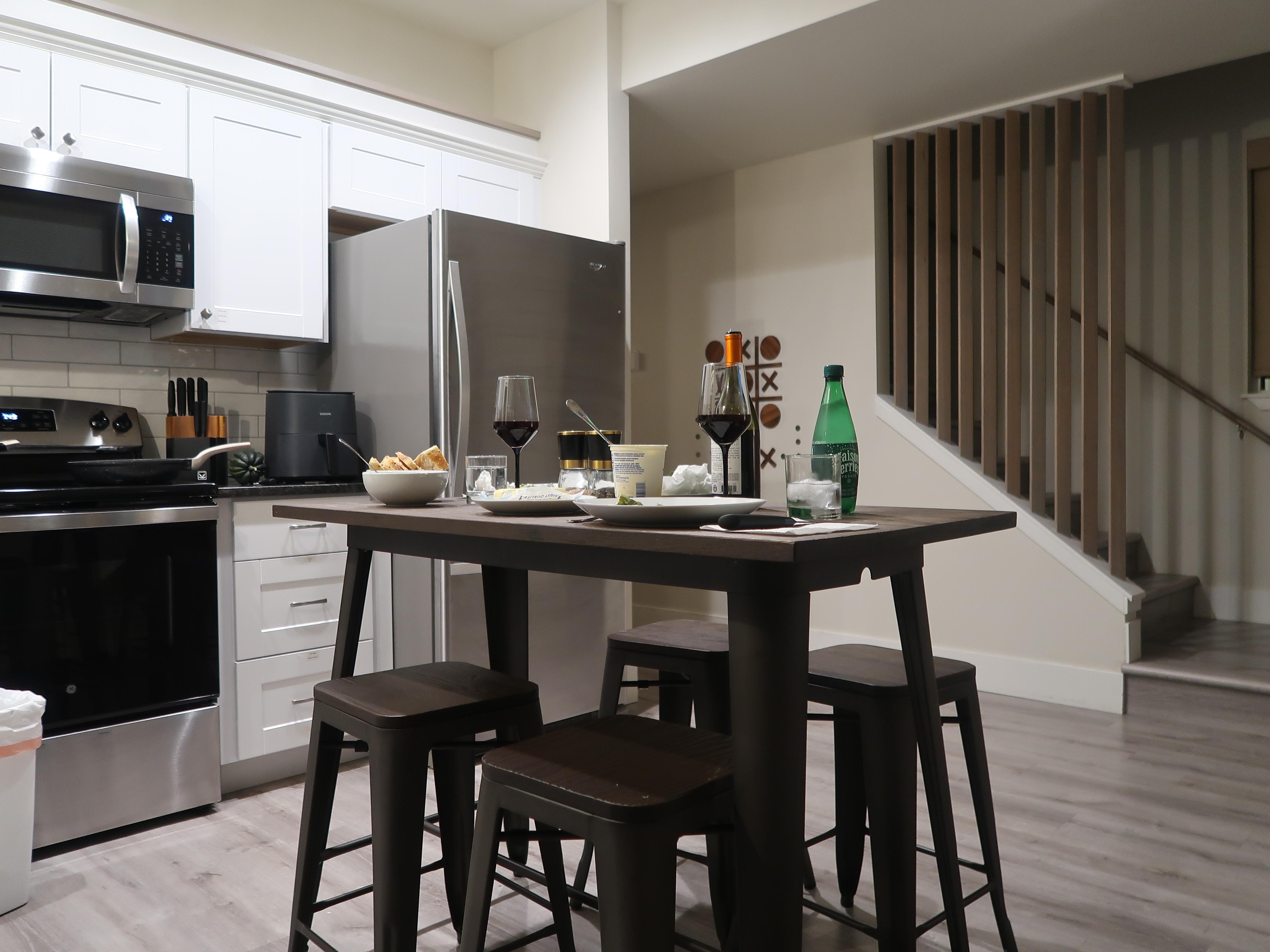 A quiet meal in the kitchen of the "Modern Hangout Den"