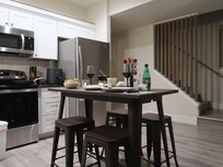 A quiet meal in the kitchen of the "Modern Hangout Den"