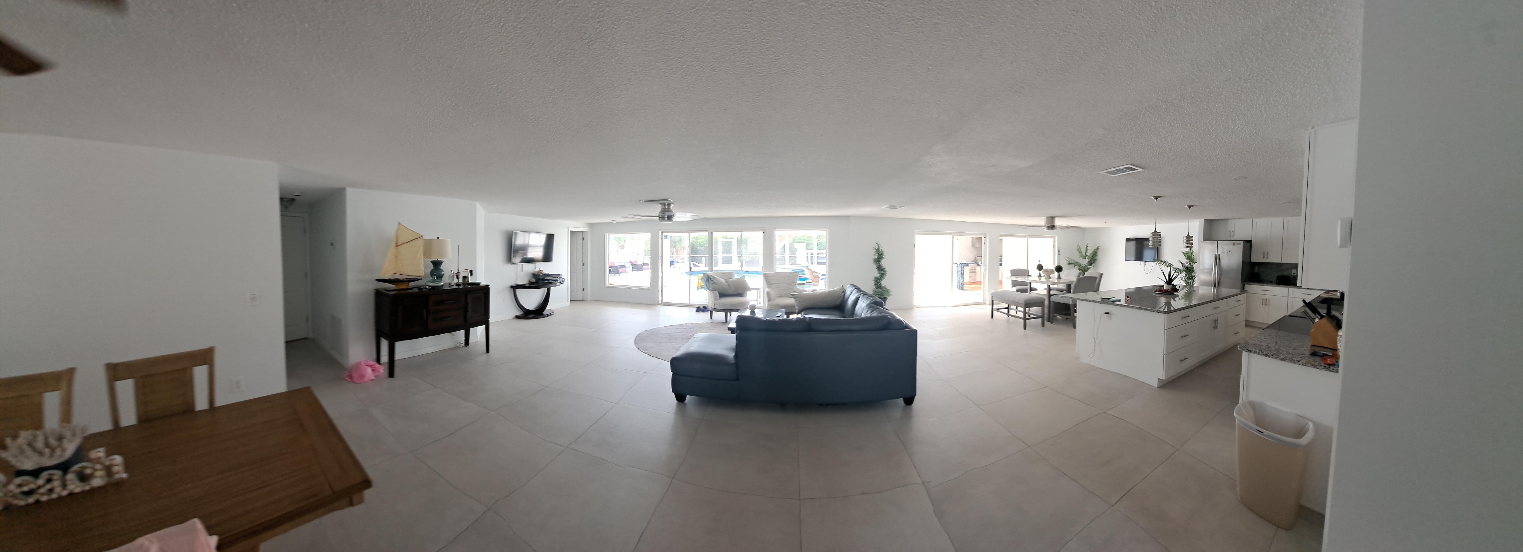Living room dining room with open floor plan into kitchen