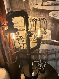 Cool lamp next to the bed.