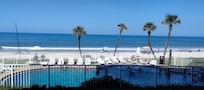 View of pool and beach from patio