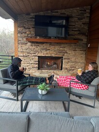 Enjoying the outdoor fireplace on a cool morning.